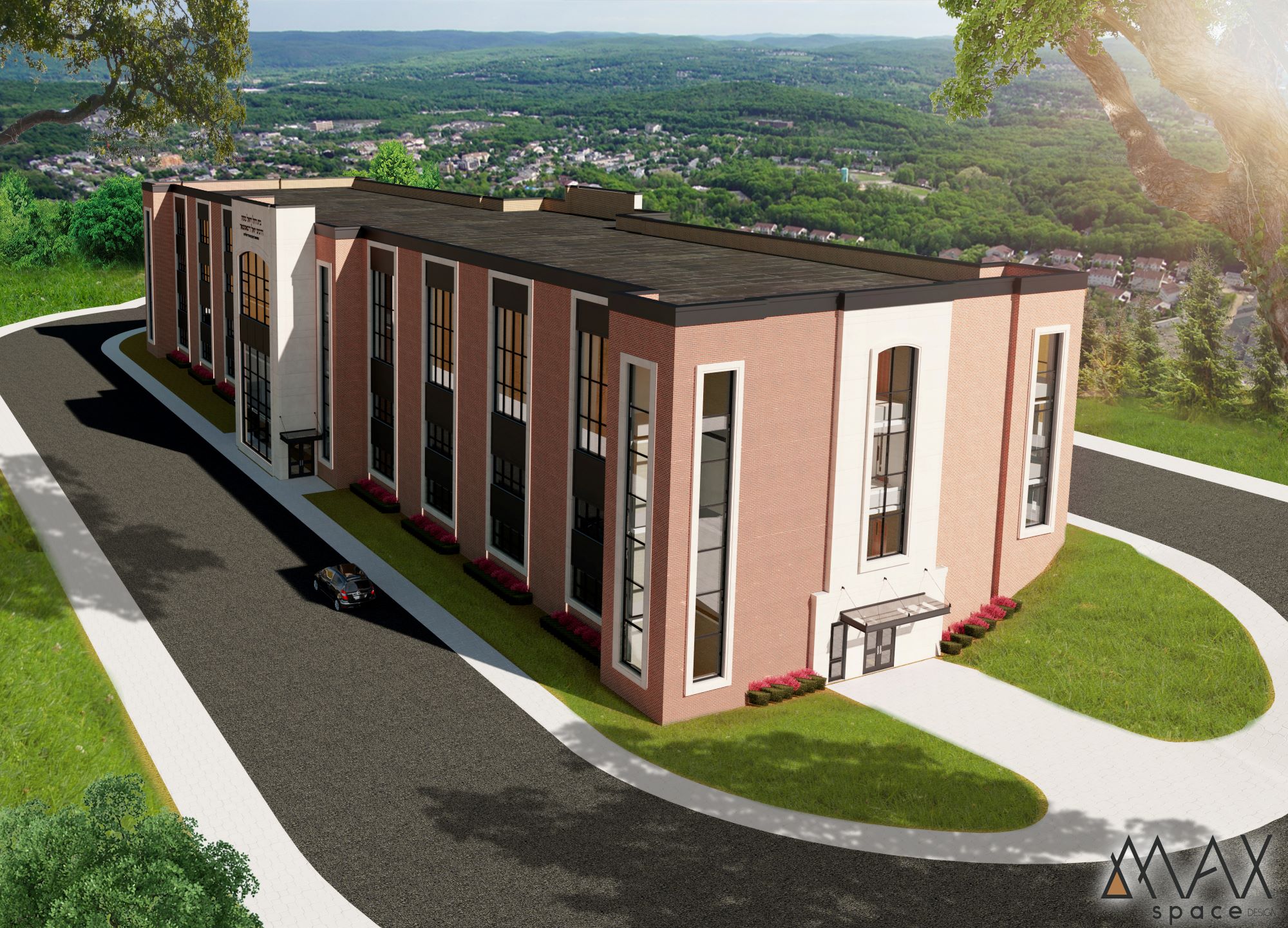 Modern building with surrounding greenery and roads.