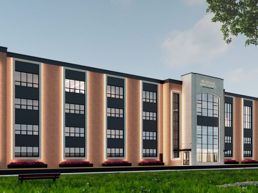 Modern brick building with large windows.
