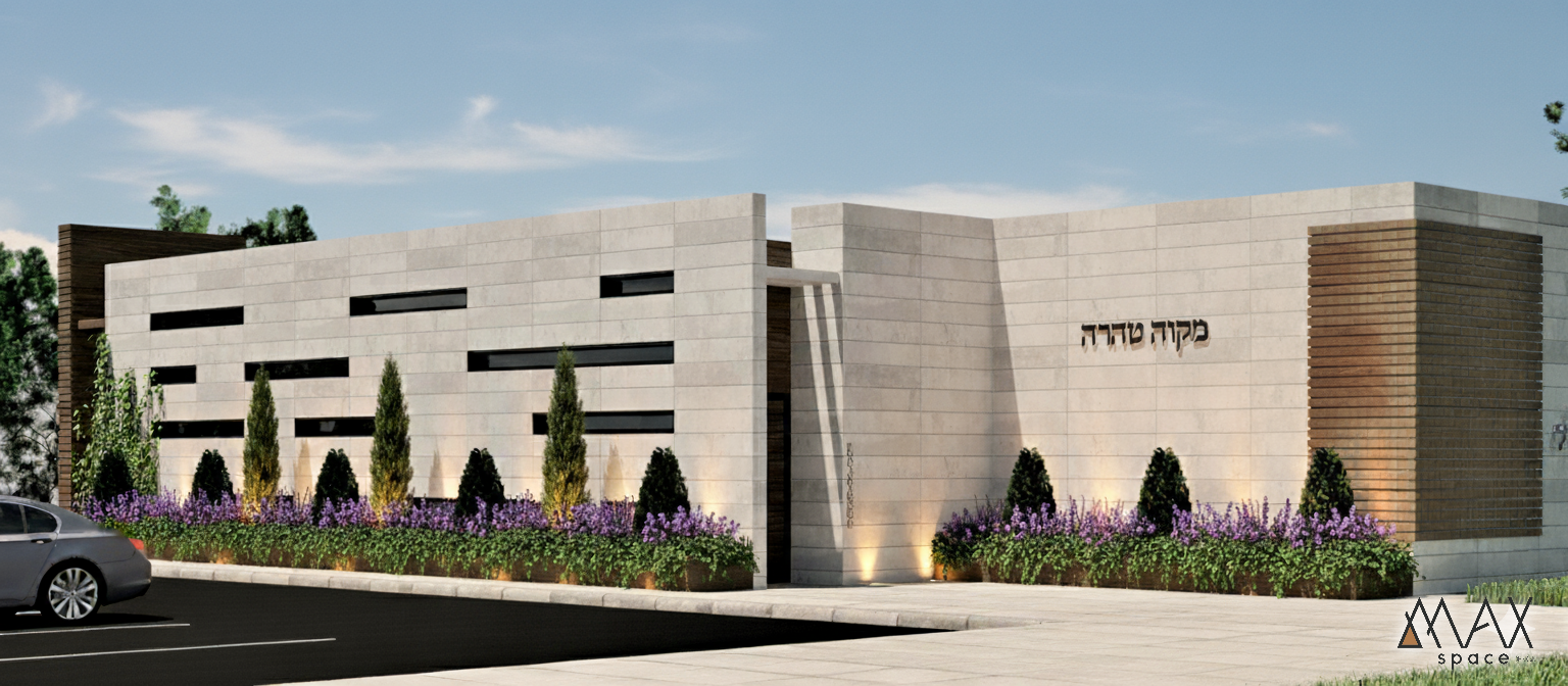 Modern building with landscaped shrubs and trees.