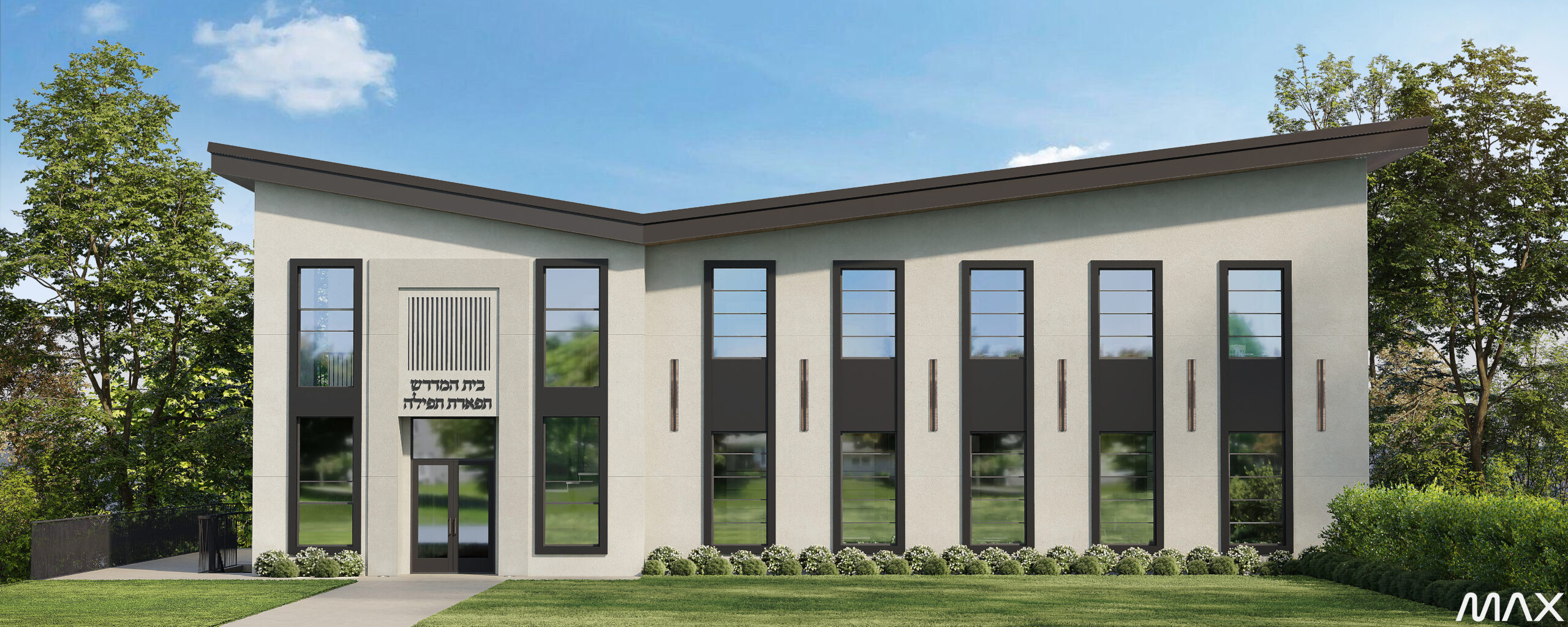 Modern building with large windows and trees.