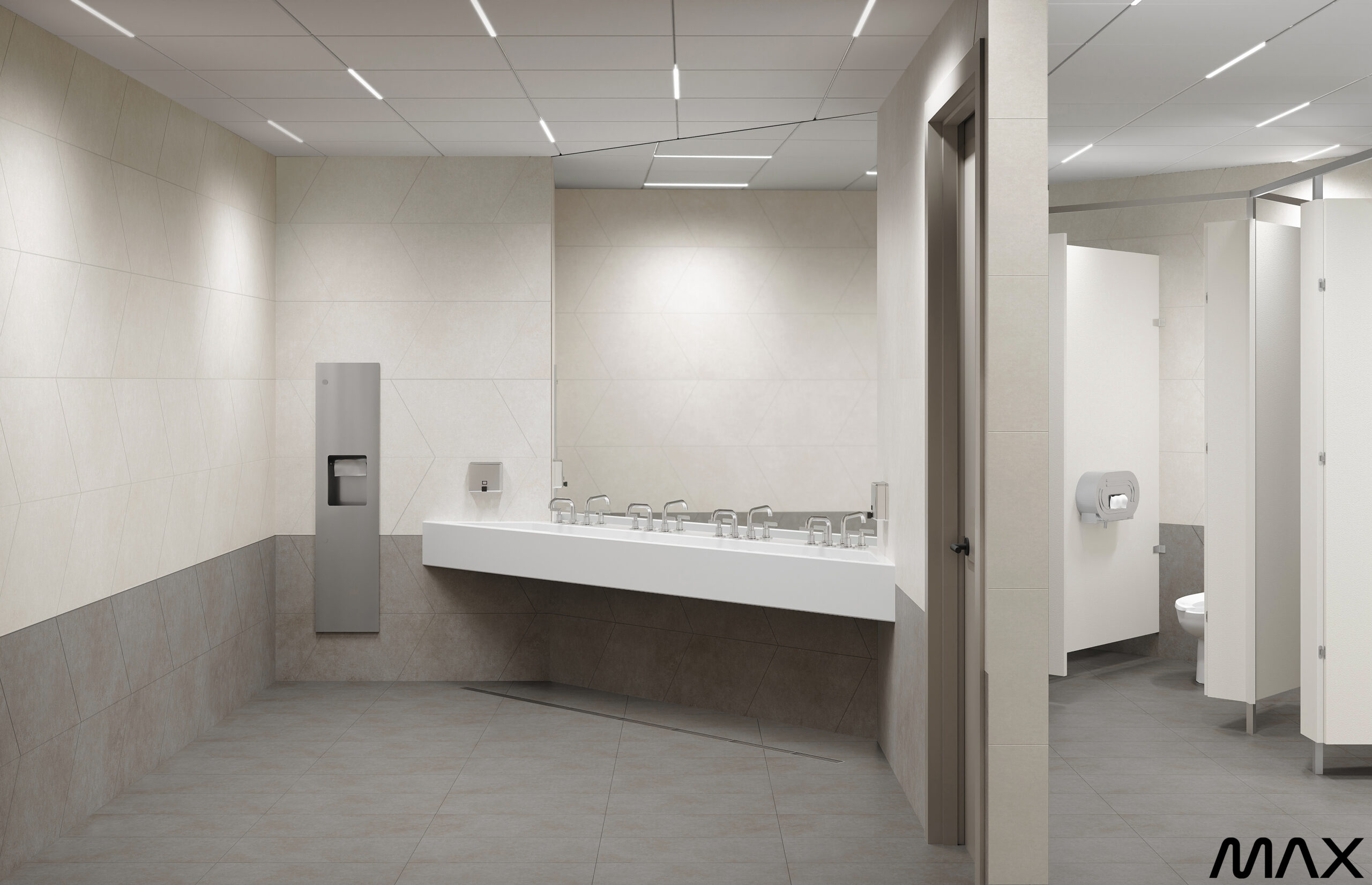 Modern public restroom with sinks and stalls.