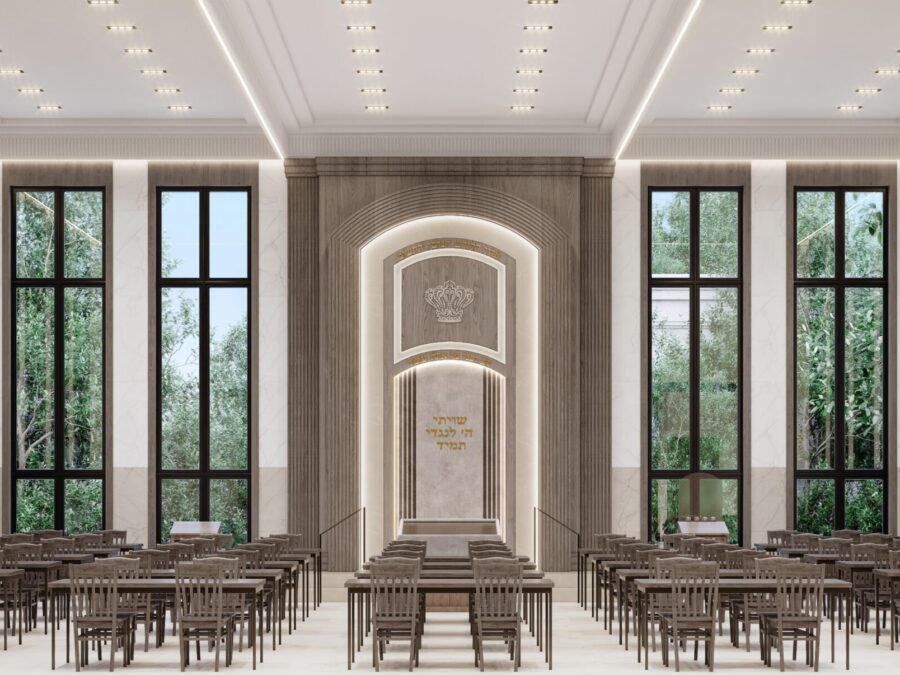 Spacious library with tall windows and bookshelves.